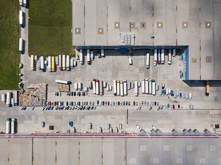Aerial view of a large logistics facility with a trailer-filled yard